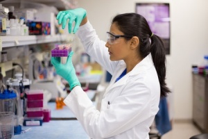 Lab technician examining lab work. From the Avidity Medical Design Blog.