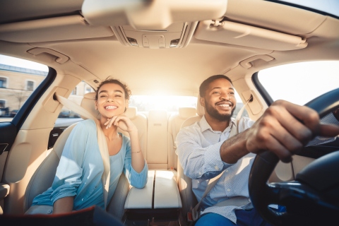 A couple in a car preparing for a long drive | staying healthy while you drive